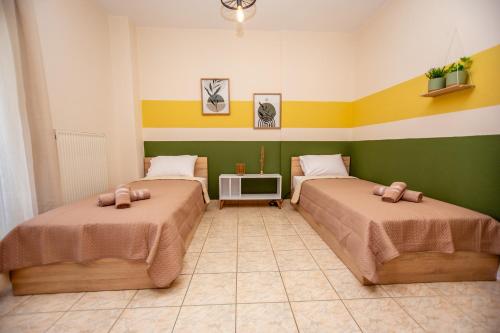 Ένα ή περισσότερα κρεβάτια σε δωμάτιο στο Theros 5