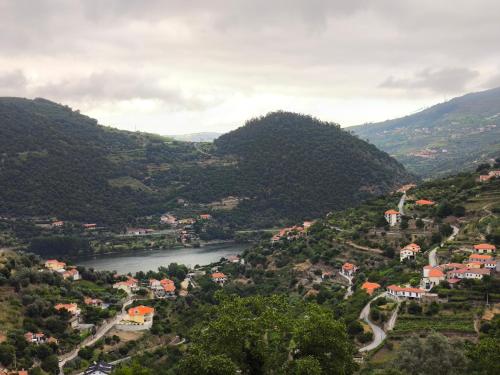 a view of a valley with a river and mountains at Quinta do Tojo in Alufinha