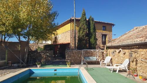 a house with a swimming pool in a yard at Villa Palula in Cardejón