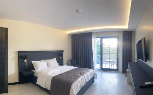 Ένα ή περισσότερα κρεβάτια σε δωμάτιο στο The Reference Club Country Resort & Restaurant Lüleburgaz