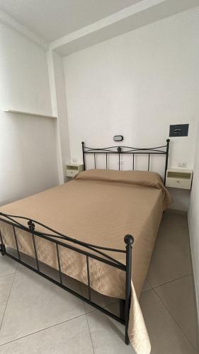 a large bed in a room with at Appartamenti da Matteo in Peschici
