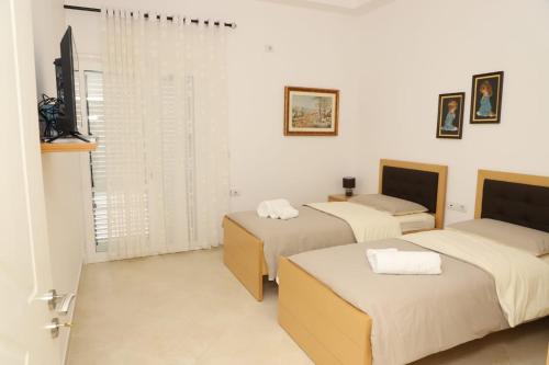 Postel nebo postele na pokoji v ubytování Vila Vokopola