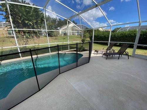 a view of a swimming pool on a house at Southern Dunes Villa Private Pool Home in Haines City