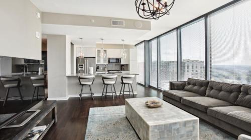 a living room with a couch and a table at Piedmont Park 3 bdrm with city views in Atlanta