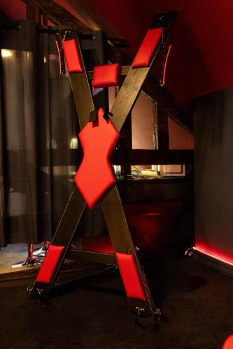 a red cross on a chair in a room at Urban Spa 3 nuances de plaisir in Troyes