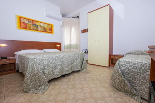 Katil atau katil-katil dalam bilik di Hotel Il Gabbiano