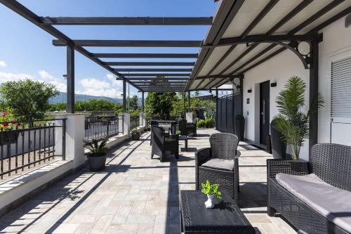 a patio with chairs and tables on a building at Testani Guest House Special in Anagni