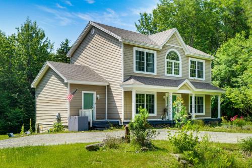 a white house with a gray roof at 6 Mi to Mt Snow Nature-View Home with Fire Pit! in West Dover