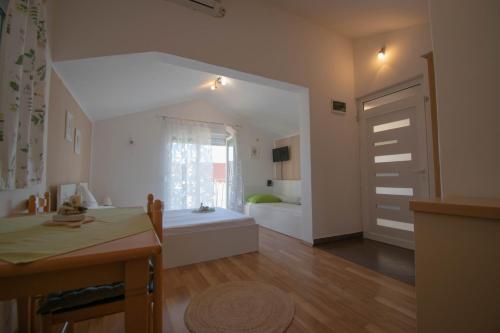a large room with a bathroom with a tub at Apartments Anita Frane in Vodice