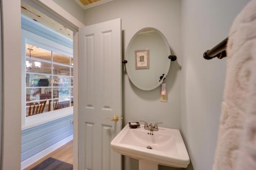 a bathroom with a sink and a mirror at Creekside Newland Cabin about 7 Mi to Linville Falls in Newland