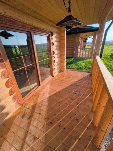 a view of the deck of a log cabin at Drevenice Rapovce Novolandia in Rapovce