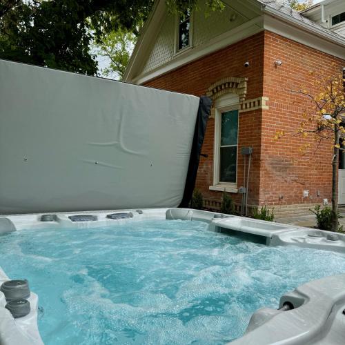 a large swimming pool in front of a house at Art City Inn in Springville