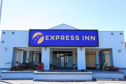 a express inn sign on the side of a building at Express Inn in Durant