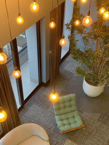 Ruang duduk di LOFT confortável e moderno com garagem perto da FURB e Vila Germânica