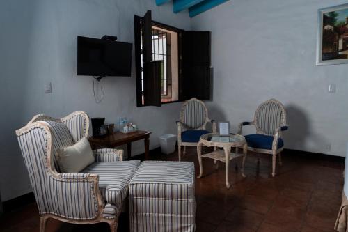 Μια τηλεόραση ή/και κέντρο ψυχαγωγίας στο Hotel Boutique Casa de Campo