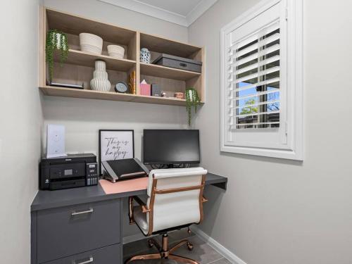 an office with a desk with a computer and a window at Hume Haven in Lake Hume