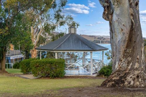a gazebo in a park next to a body of water at Hume Haven in Lake Hume