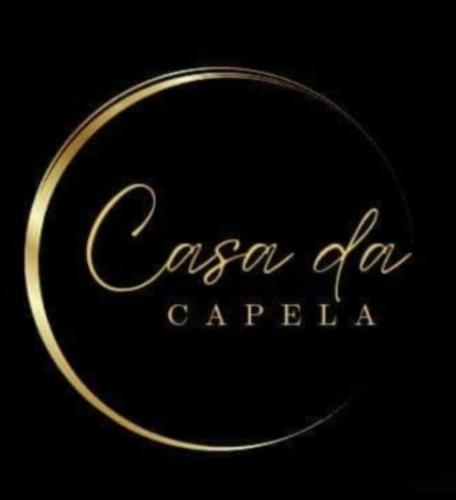 a sign that says casa farazaazaazaaza in a black background at Casa da Capela in Entre Ambos os Rios