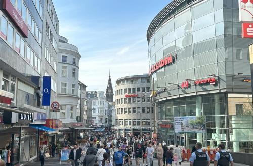a crowd of people walking down a busy city street at Stylish and Modern 2-Room Apartment in Wuppertal City Center in Wuppertal