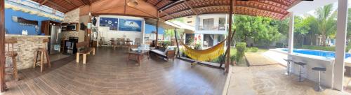 a house with a hammock in the middle of a room at Quinta las praderas in Coyolar