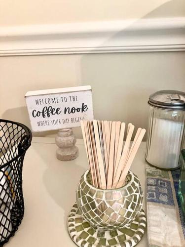 a counter top with a bowl of chopsticks and a sign at Meadow View Acres - 6 acre spacious estate 20 min from UVA in Charlottesville