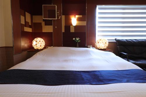 Postel nebo postele na pokoji v ubytování Spa & HOTEL La fontaine