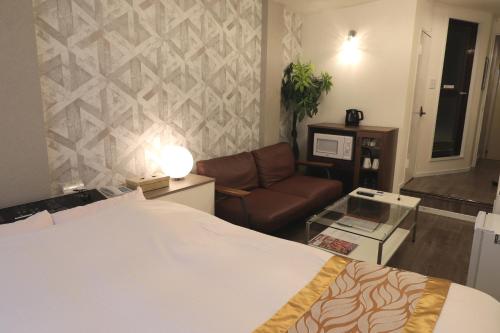 Postel nebo postele na pokoji v ubytování Spa & HOTEL La fontaine