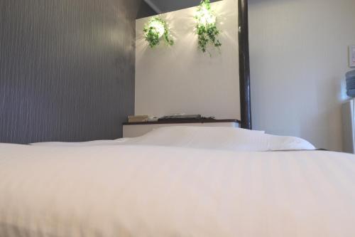 Postel nebo postele na pokoji v ubytování Spa & HOTEL La fontaine