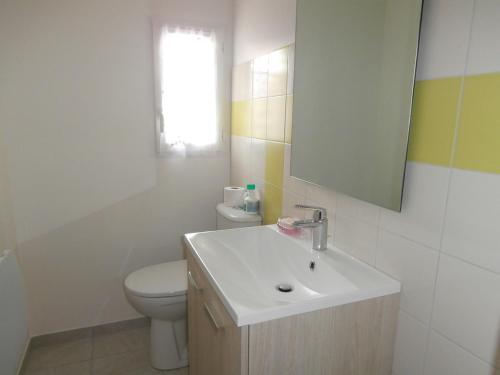 a bathroom with a sink and a toilet and a mirror at Le Barcarès - Villa T3 Coquette - Résidence Calme - Proche Plage, Port, et Village - Parking Privé - FR-1-799-38 in Le Barcarès