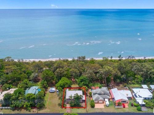 an aerial view of a house and the beach at Kingfisher by the Sea in Toogoom