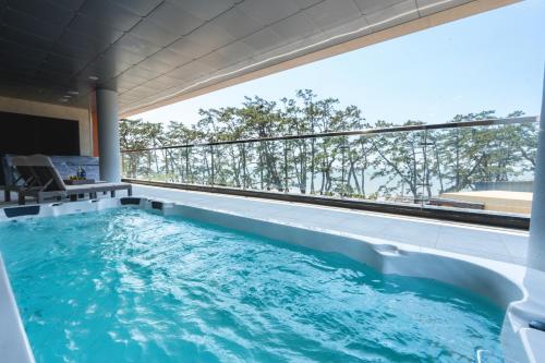a swimming pool in the middle of a house at Dongho Beach Hotel in Gochang 