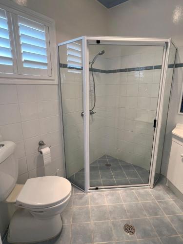 a bathroom with a shower and a toilet at Adacos 19 On Sturt - Bring your own linen in South West Rocks