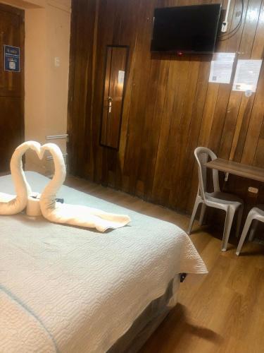 Una cama o camas en una habitación de Hostal Choja