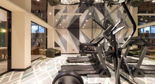a gym with treadmills and a treadmill at Nost algia S Hotel Hangzhou West Lake & Lingyin Temple 时光漫步S酒店杭州西湖店 Free laundry service, Free fresh ground coffee in Hangzhou