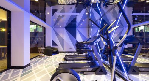 a gym with cardio equipment in a room at Nost algia S Hotel Hangzhou West Lake & Lingyin Temple 时光漫步S酒店杭州西湖店 Free laundry service, Free fresh ground coffee in Hangzhou