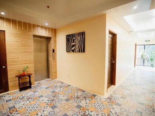 Postel nebo postele na pokoji v ubytování ARC Homes Hotel Panglao powered by Cocotel