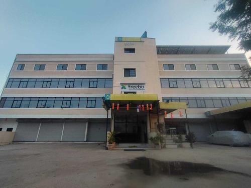 a building with a store in front of it at Hotel O Grand Executive in Chikalthān