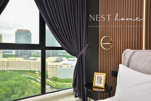 a bedroom with a window with a view of a city at Midvalley Southkey Mosaic Suite by Nest Home in Johor Bahru
