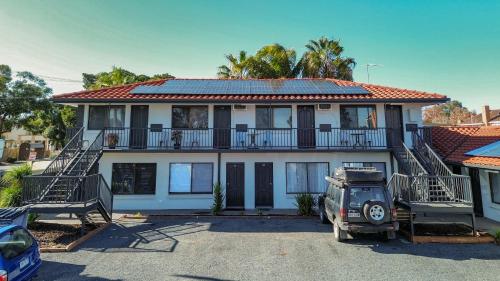 a house with a car parked in front of it at Sanz Motel Wentworth in Wentworth