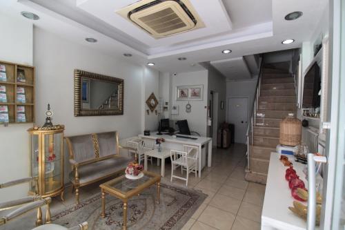 a living room with a table and a desk at Lemon Residence in Istanbul