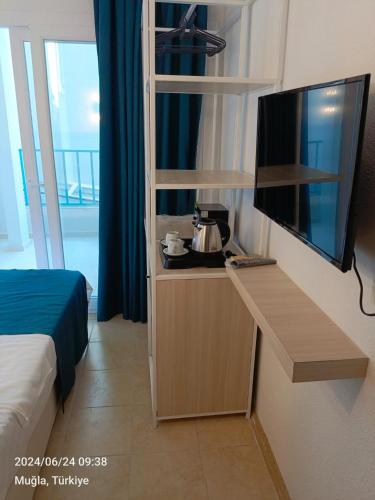 Televisyen dan/atau pusat hiburan di Mia Hill Suites