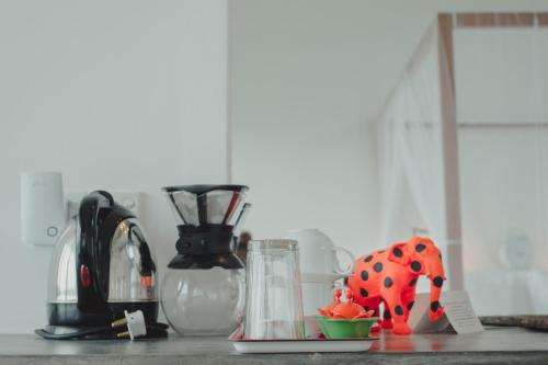 a kitchen counter top with a cow toy on a table at Villa Amma Erna - Galle in Galle
