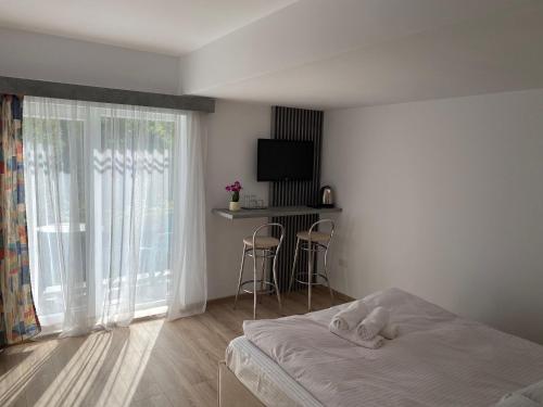 Кровать или кровати в номере Camera Deluxe Pensiunea Liziera