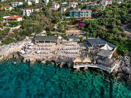 an aerial view of a resort on the water at Aquarius Hotel in Kas