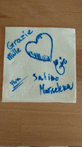 a napkin with a heart and the words strike me baking nineteen at Casa Di Luce in Montesilvano