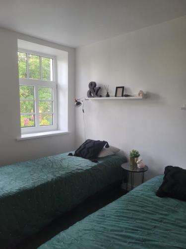 En eller flere senge i et værelse på Boutique hotel MEŅĢELES PIENOTAVA