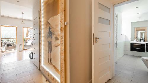 a bathroom with a toilet and a sink at Aparthotel Delta Boutique in Kościelisko
