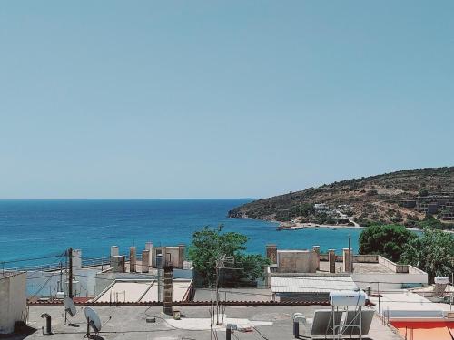 a view of the ocean from a building at Hotel Liliana in Agia Marina Aegina
