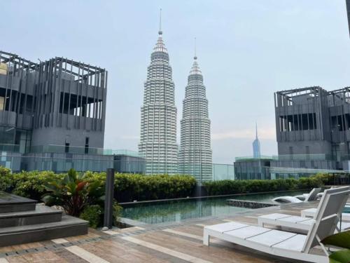 a view of the petronas twin towers from the rooftop of a building at Star Residence 2br Unit Floor 46 in Kuala Lumpur