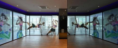 a room with a woman doing a trick in the air at Star Residence 2br Unit Floor 46 in Kuala Lumpur